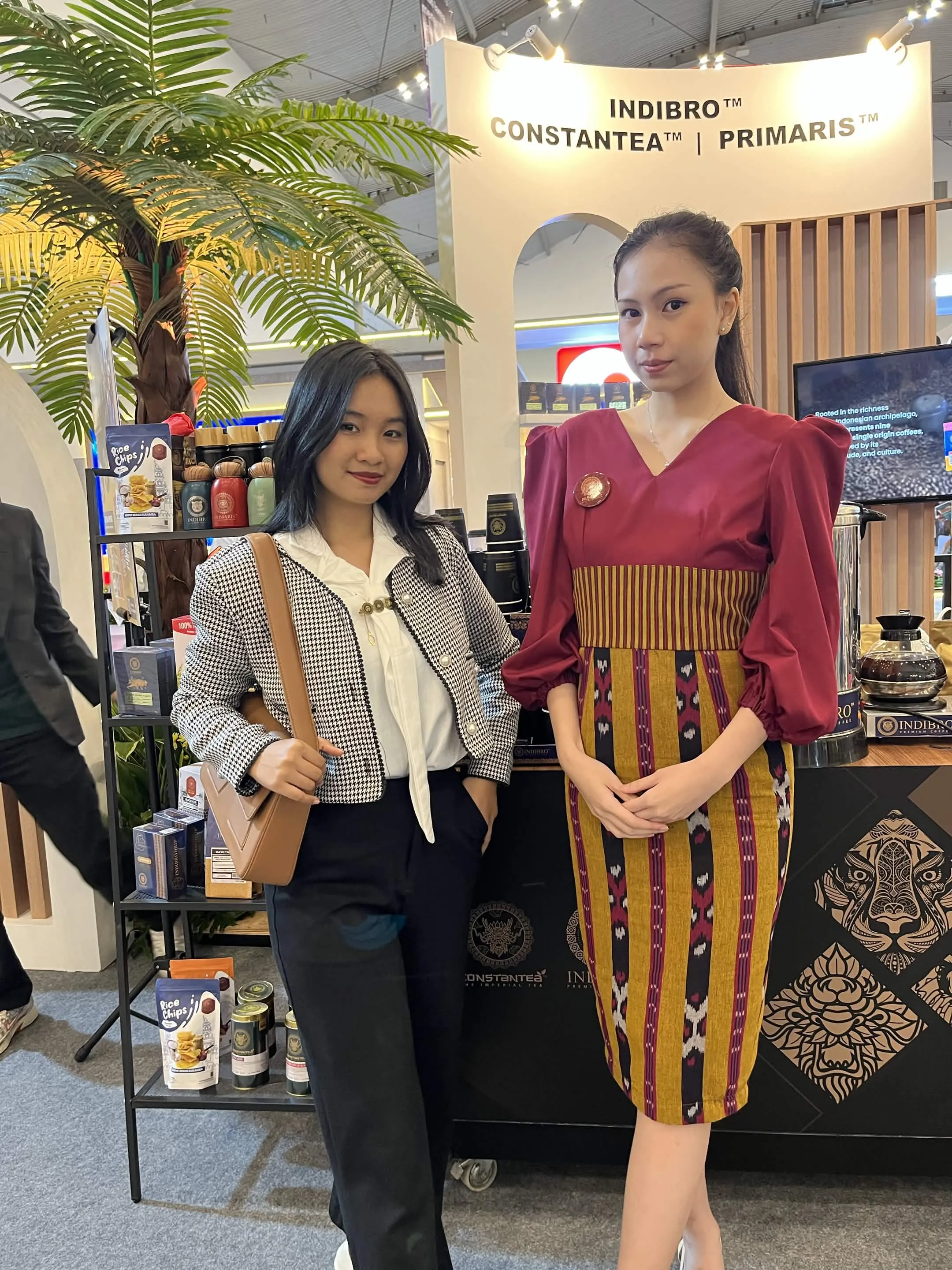 Cindy and a colleague at a three-brand exhibition booth