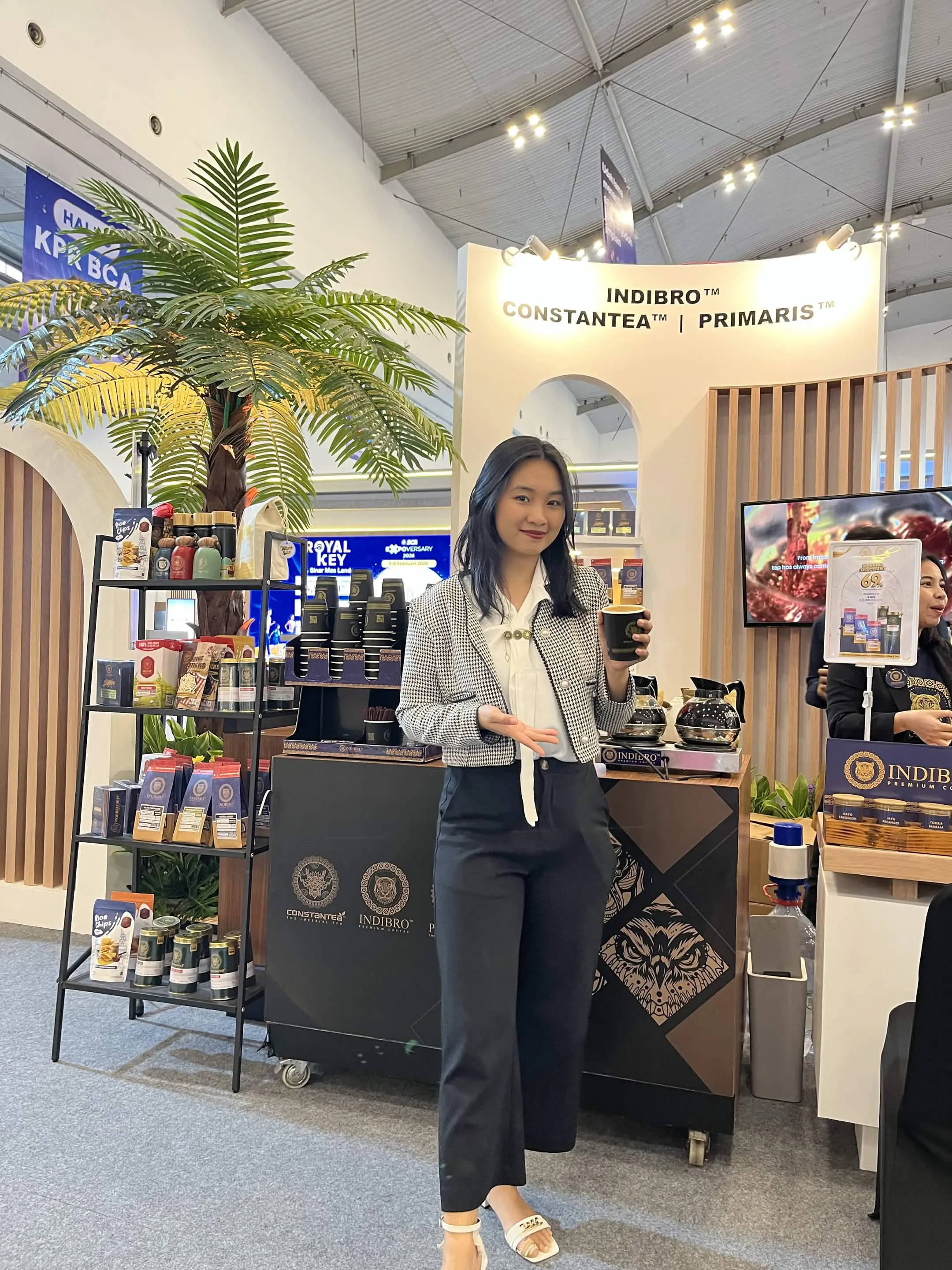 Cindy beside a BCA project display